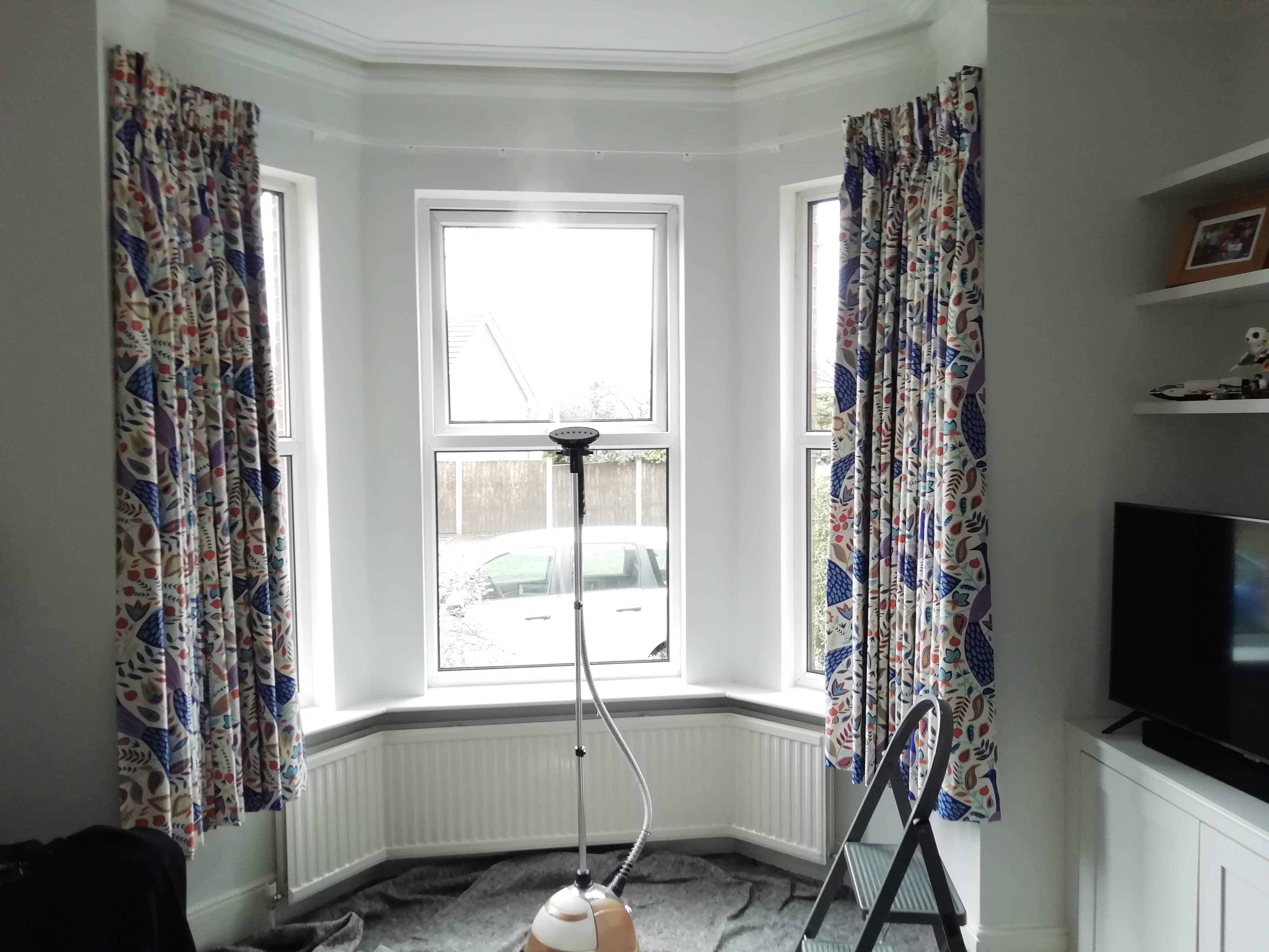 Curtains hanging within bay