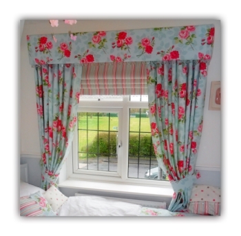 Stunning Fabric covered pelmet with matching curtains. Also a striped roman blind using the same vibrant colour pallete.