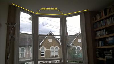 Bay window curtain track internal bends